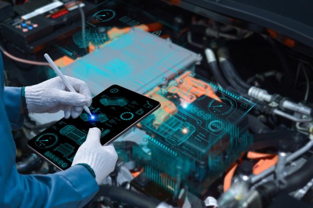 Auto mechanic using a tablet wireless scanning tool to check the ECU engine system