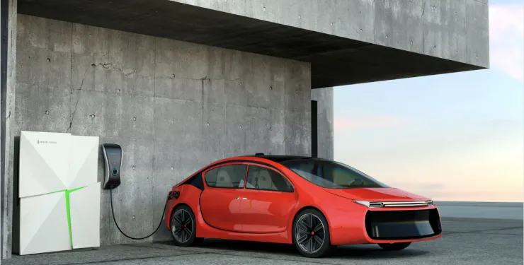 Electric vehicle plugged into a charging station