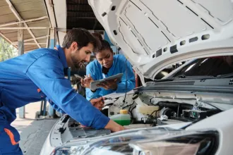 EV Technician inspecting a car