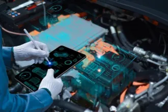 Auto mechanic using a tablet wireless scanning tool to check the ECU engine system