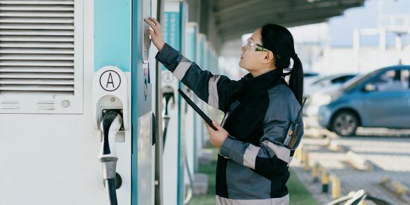 EV Technician fixing charging station